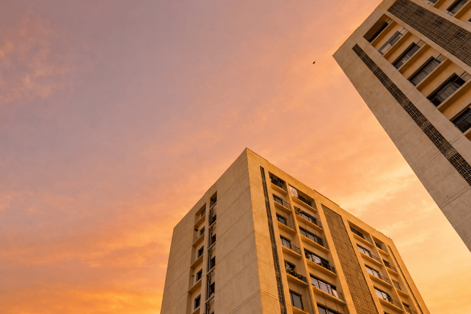 Modern apartment buildings during sunset